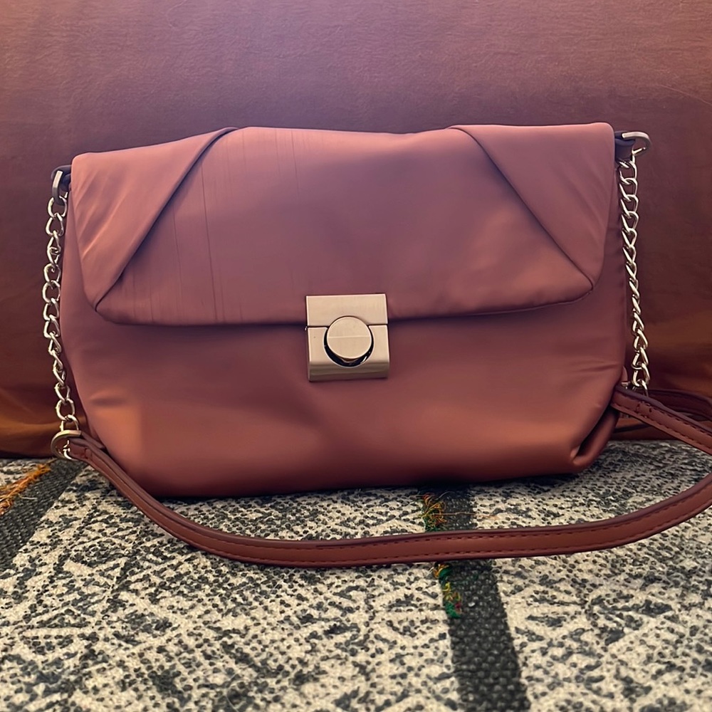 SOLD. A New Day rose gold purse with removable strap. Worn one time.